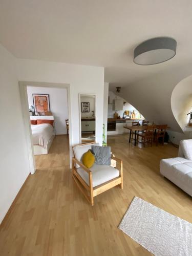 a living room with a couch and a table at Lichtblick in Radebeul