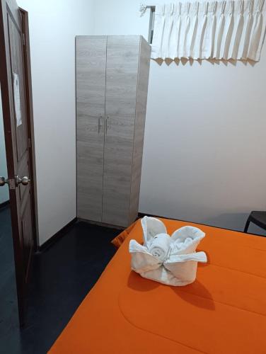 a room with a bed with a towel on it at HOTEL BOUTIQUE TerrazaINN in Arequipa