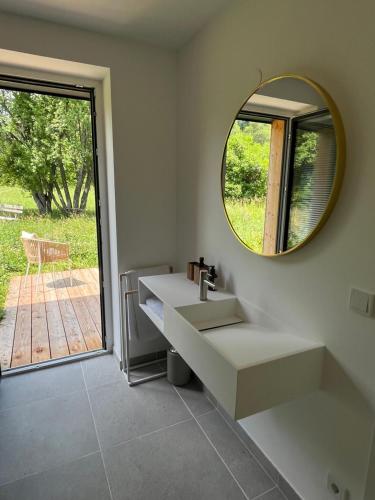 a bathroom with a sink and a mirror at Refugium Mitterbach in Mitterbach