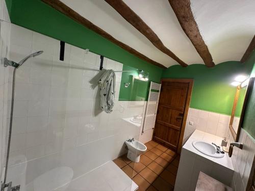 a bathroom with a shower and a toilet and a sink at Casa Rural Iturrieta in Adiós