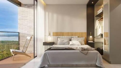 a bedroom with a large bed and a balcony at Beach GAV Resort in Salinópolis