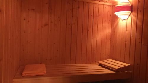 a sauna with a bench in a wooden wall at Parador de Alcañiz in Alcañiz
