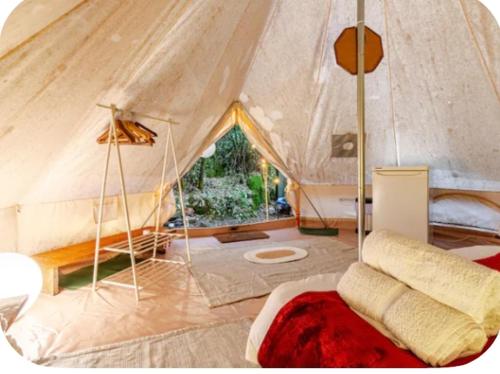 a room with a tent with a bed in it at Glamping Boutique in Comillas