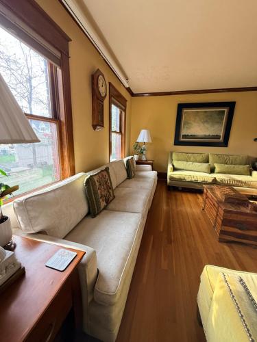 a living room with a couch and a table at This Old Frat House Boutique Guest in Missoula