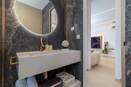 a bathroom with a sink and a mirror at Royal Oak beachfront residence Trogir Seget Vranjica in Seget Vranjica