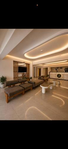 a large living room with a couch and a table at tyty cairo hotel in Cairo