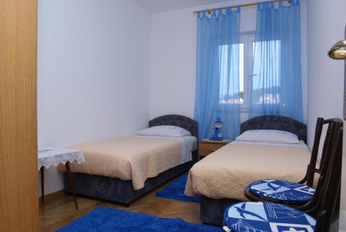 Кровать или кровати в номере Apartment Jasovic