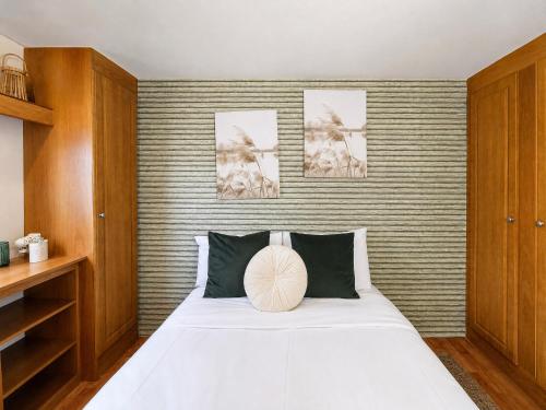 a bedroom with a bed with a pillow on it at 1A Casa Azul in Pataias