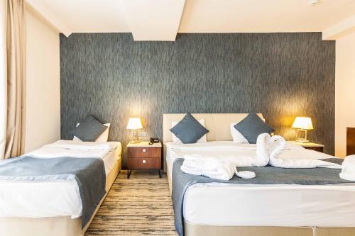 Ένα ή περισσότερα κρεβάτια σε δωμάτιο στο Port View Hotel