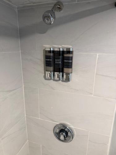 a shower stall with a sink and a shower facet at 50 Private Lounge in Irvington