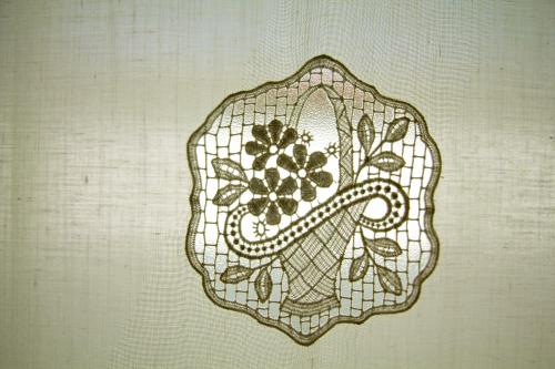 a drawing of a mask with a flower on it at Turistična kmetija Štanfel in Podsabotin