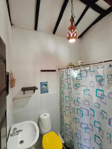 a bathroom with a sink and a shower at Cabañas Cañon Del Chicamocha in Aratoca