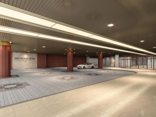 a parking garage with a car parked in it at ANA Crowne Plaza Kochi by IHG in Sagamichō