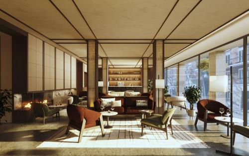 a living room with a couch and chairs at DoubleTree by Hilton Madrid Principe de Vergara in Madrid