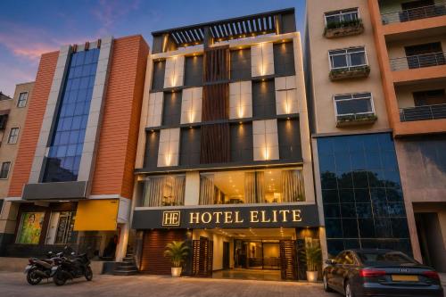 a hotel elite with a motorcycle parked in front of it at Hotel Elite kukatpally Near Nexus Mall in Hyderabad