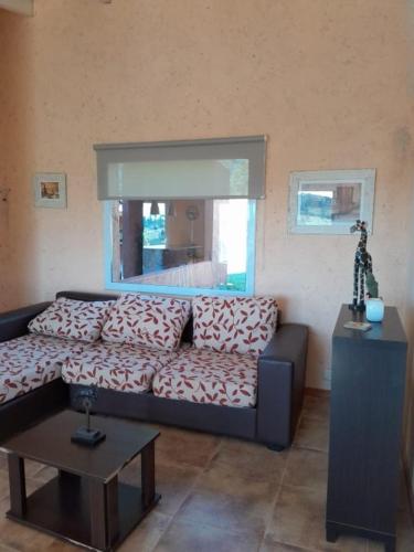 a living room with a couch and a table at Iorana in Villa Berna