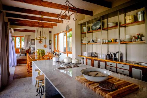 a kitchen with a counter with a bowl on a table at Vrisch Gewagt Boutique Self-Catering Olive Farm in Prince Albert