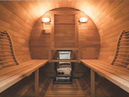 an inside view of a sauna with two benches at #65 Stella 八ヶ岳姫木平 in Tateshina