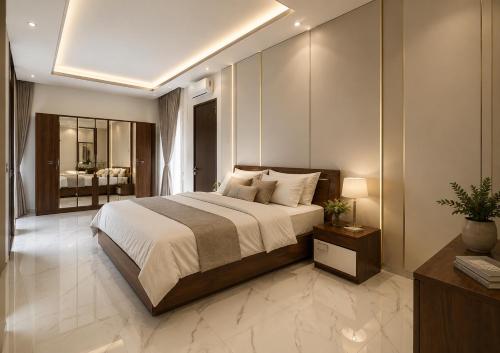 a bedroom with a large bed and a bathroom at Chenz Guest House in Ancol