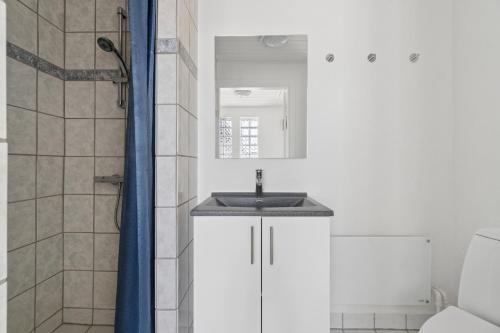 a bathroom with a sink and a shower at Spacious Holiday Home With Water View in Redsted