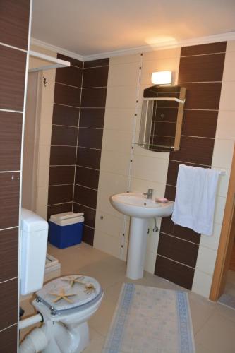 Koupelna v ubytování Apartments Salute