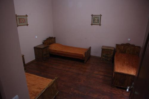 a room with two beds and two tables in it at Guest house Dilijan Orran in Dilijan