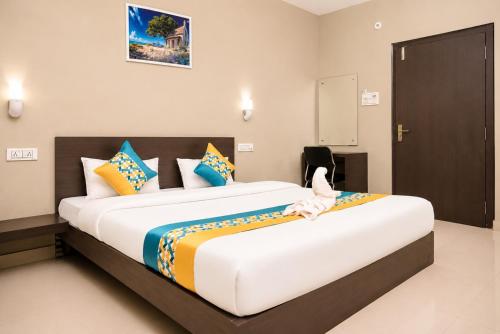 a bedroom with a large bed in a room at Vilasa Prime Hotel in Guwahati