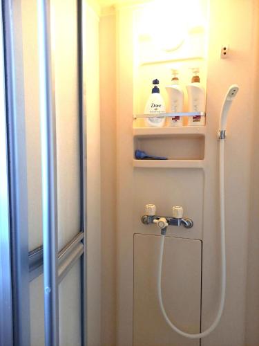 a shower in a bathroom with a door open at Bibi Vacation Rental Only 2 groups per day Vacation STAY 1284 in Sakai