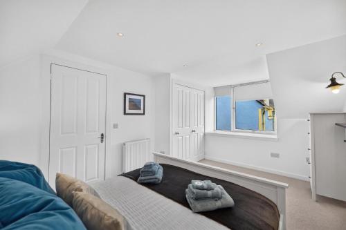 a living room with a couch and a window at Conners in Gardenstown