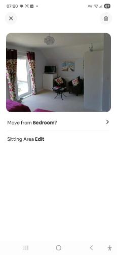 a room with a bed and a refrigerator at Spacious Luxury Room in Brixham