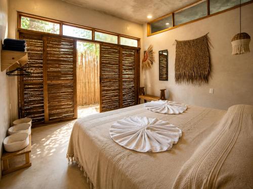 Llit o llits en una habitació de Amixtli