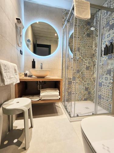 a bathroom with a shower and a sink at Hotel Campion CityLife in Milan