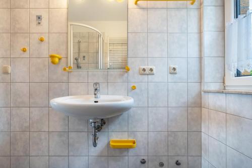 a bathroom with a sink and a mirror at Haus S 42 in Röbel