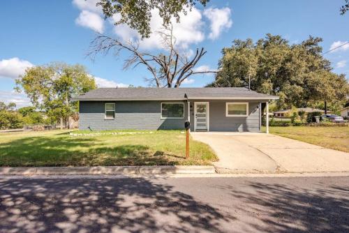 a house on a street with a driveway at Remodeled 4BR 2BA Steps from Georgetown Square in Georgetown