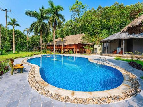 an image of a swimming pool at a resort at An Binh Village in Yên Bình