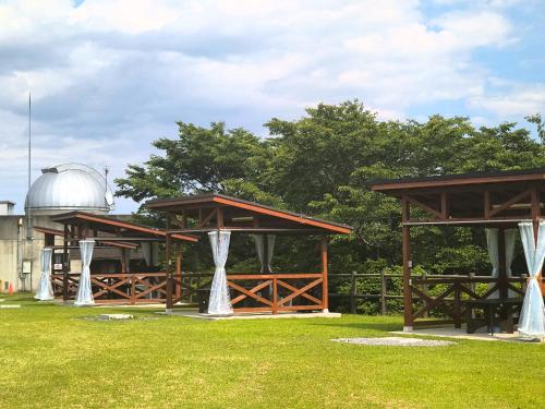 a pavilion with a observatory in a grass field at Maruta ひたち大宮 in Takabu