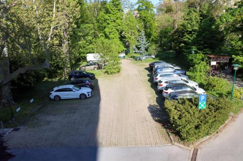 a row of cars parked in a parking lot at Seminarhotel Springer Schlössl in Vienna