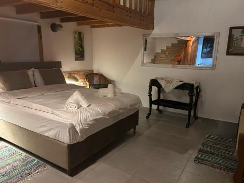 a bedroom with a bed and a chair in it at Denis House in Keramoti