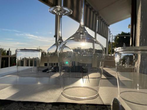 two empty wine glasses sitting on top of a table at Giglio in Volastra