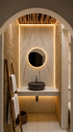 a bathroom with a sink and a mirror at Mahatva Borobudur Resort in Borobudur