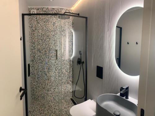a bathroom with a shower and a sink at Sol 41 in Bragança