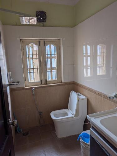 a bathroom with a toilet and a sink at Heritage View Homestay, Kathmandu in Kathmandu