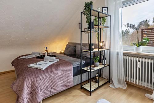 a bedroom with a bed and a book shelf at Ferienappartement Sonnenhof in Triberg