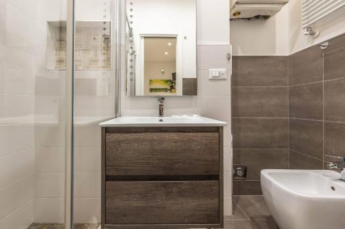 a bathroom with a sink and a mirror at De'Giudei, Bologna by Short Holidays in Bologna