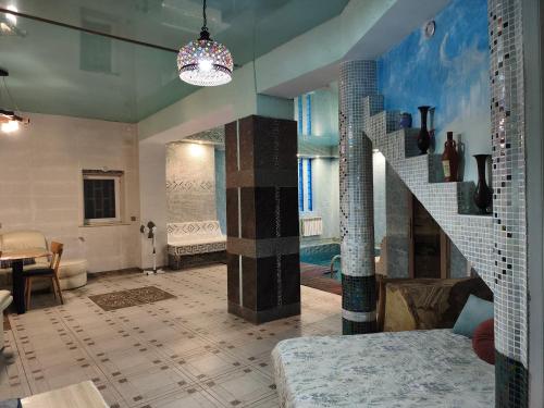 a bathroom with a staircase and a swimming pool at Дом у моря с бассейном и сауной in Odesa