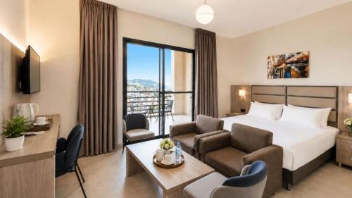 Krevet ili kreveti u jedinici u okviru objekta Iris Flower Hotel