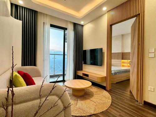 a living room with a couch and a large mirror at Chill House in Hai Phong