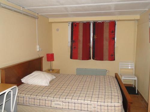 En eller flere senge i et værelse på Gîte Debussy