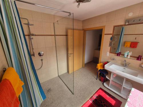 a bathroom with a shower and a sink at Bed & Breakfast Simone in Imst