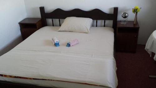 a bed with two packs ofodorizers sitting on it at Guesthouse Mala Venecija in Virpazar
